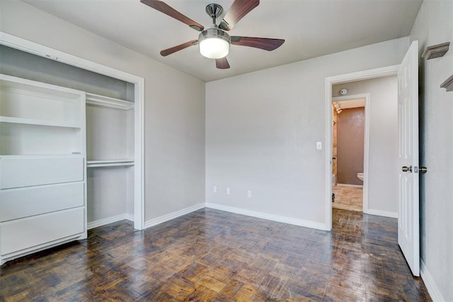 unfurnished bedroom featuring a closet, baseboards, ceiling fan, and wood finished floors