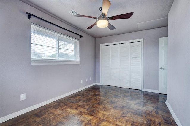 unfurnished bedroom with visible vents, baseboards, a closet, and ceiling fan