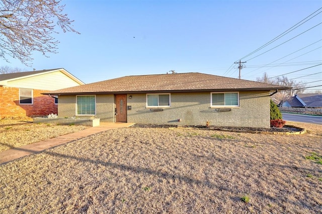 single story home with brick siding