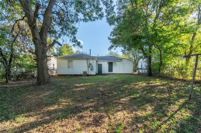 exterior space with a front yard, crawl space, and fence