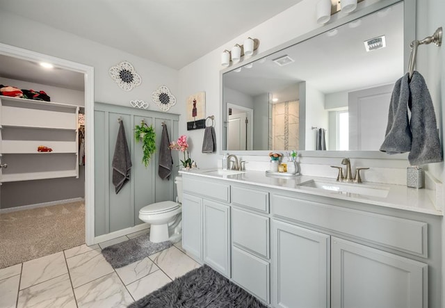 full bathroom featuring a sink, visible vents, marble finish floor, and double vanity