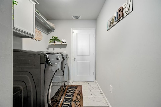 washroom with visible vents, marble finish floor, independent washer and dryer, cabinet space, and baseboards