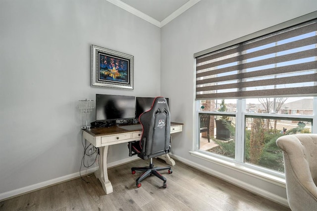 home office featuring baseboards, wood finished floors, and crown molding