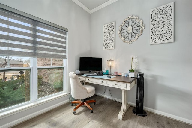 office area with baseboards, wood finished floors, and crown molding