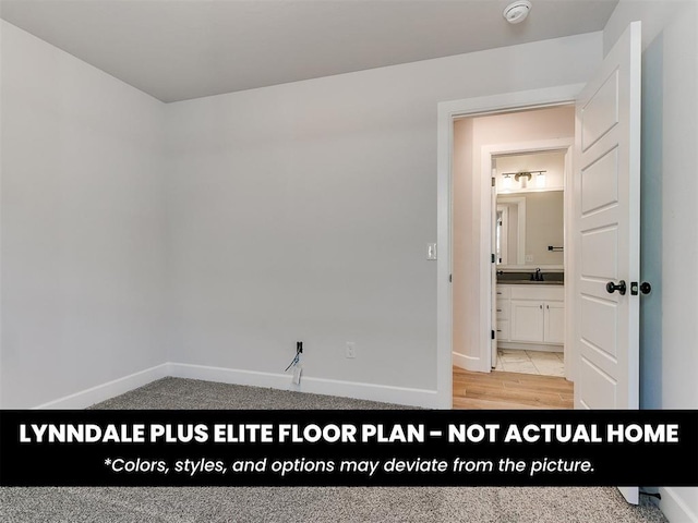 unfurnished room with baseboards