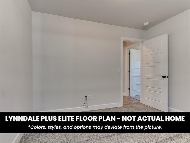 empty room with carpet floors and baseboards