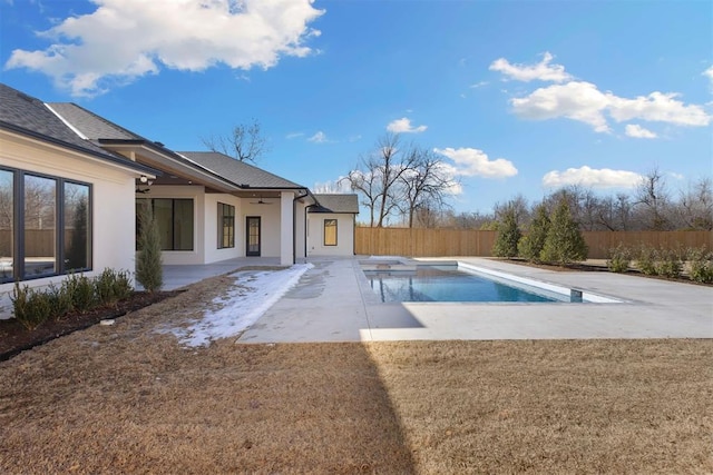 view of pool with a fenced in pool, a patio area, a fenced backyard, and a ceiling fan