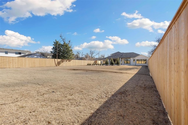 view of yard featuring a fenced backyard