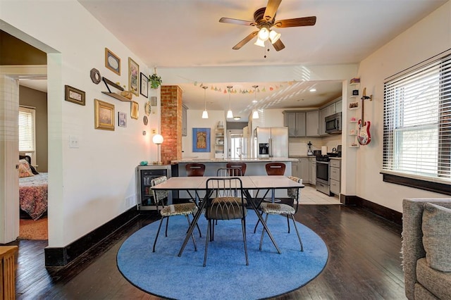1721 NW 29th St, Oklahoma City, OK 73106 - dining area featuring wine cooler, wood-type flooring, and healthy amount of natural light