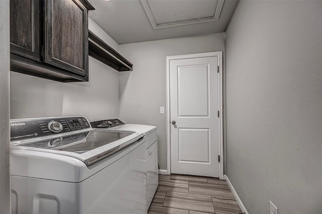 laundry room featuring cabinet space, independent washer and dryer, and baseboards