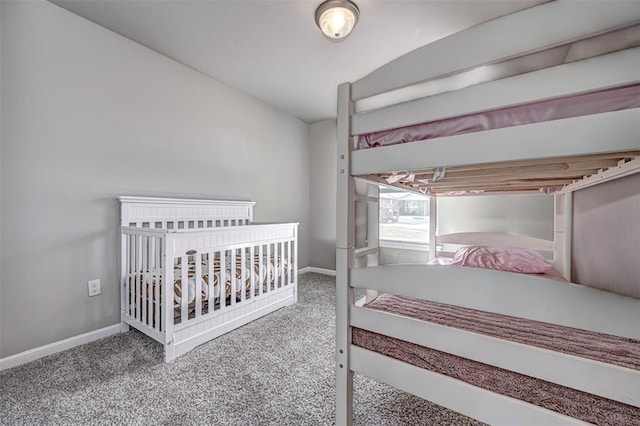 carpeted bedroom with baseboards