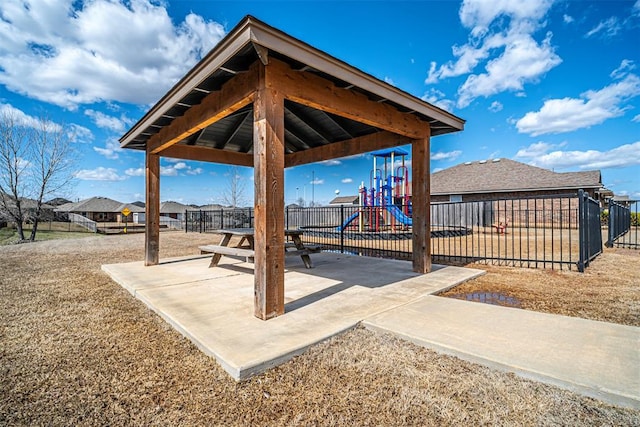 view of patio / terrace with fence and playground community