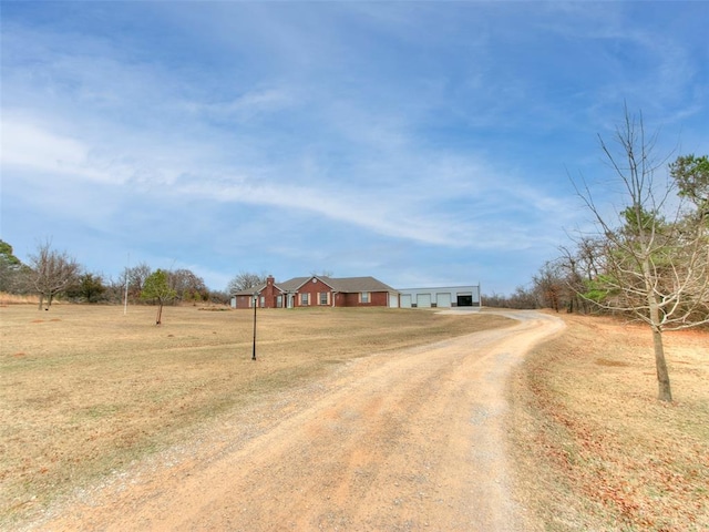 exterior space with dirt driveway