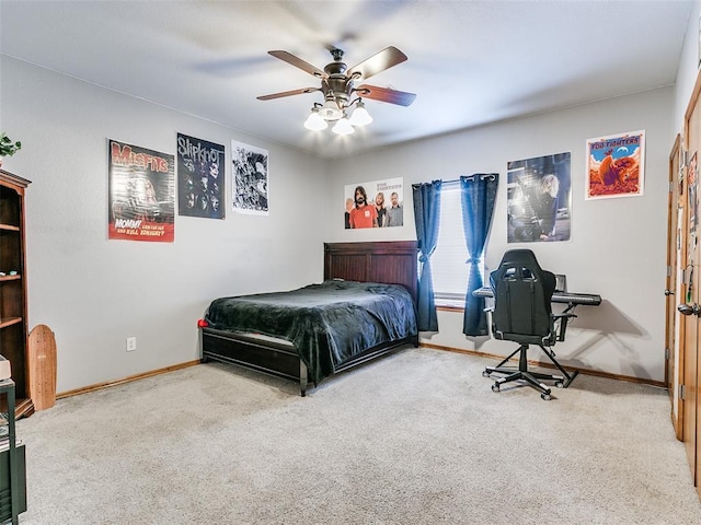 bedroom featuring ceiling fan, carpet, and baseboards