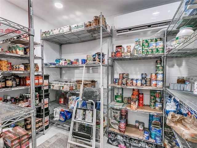 pantry with a wall mounted AC