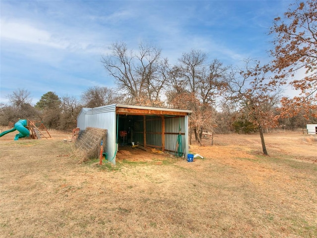 view of pole building with a lawn