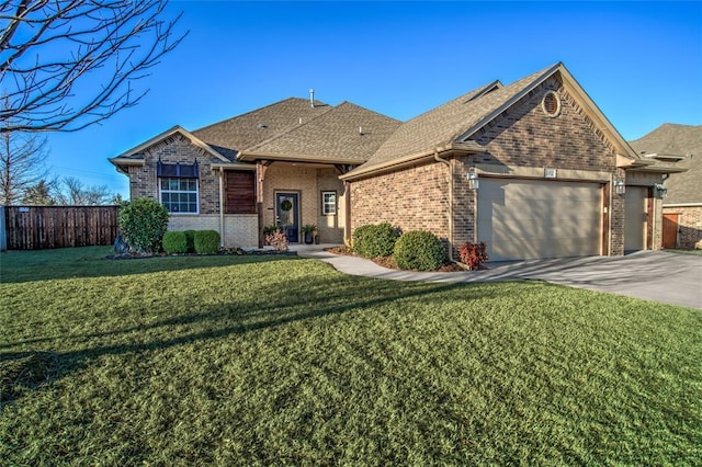 single story home featuring brick siding, fence, a front yard, a garage, and driveway