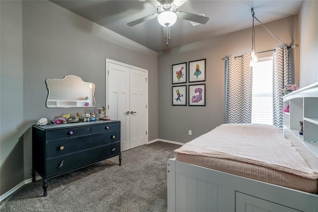 carpeted bedroom featuring a closet, a ceiling fan, and baseboards