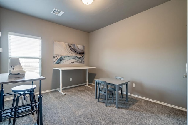 dining area featuring baseboards, visible vents, and carpet floors