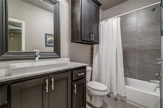 full bathroom with vanity, toilet, and shower / tub combo