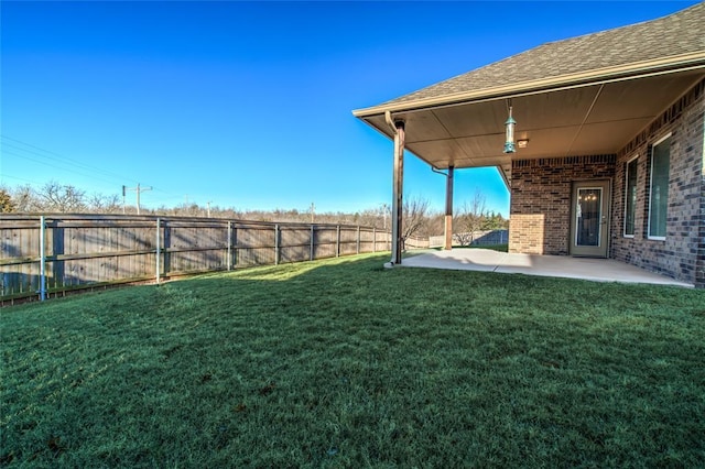 view of yard with a patio and a fenced backyard