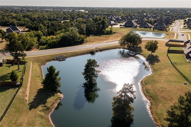 bird's eye view with a residential view and a water view