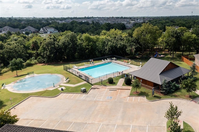 view of pool featuring fence