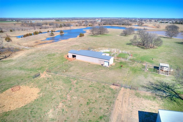 aerial view with a rural view and a water view