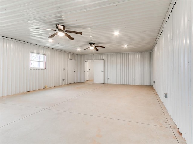 unfurnished room with concrete flooring and metal wall