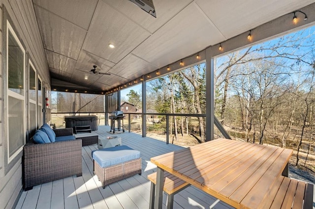 wooden deck with an outdoor living space