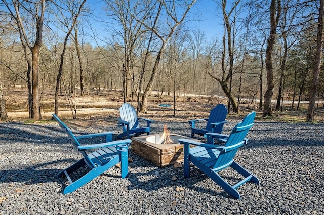 view of yard with an outdoor fire pit