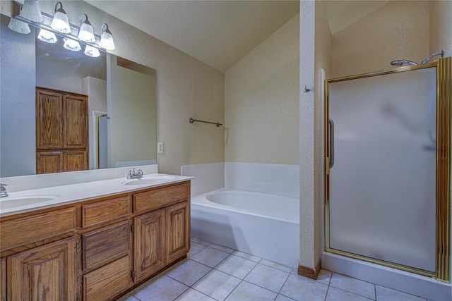 bathroom with tile patterned flooring, a sink, a shower stall, and a bath