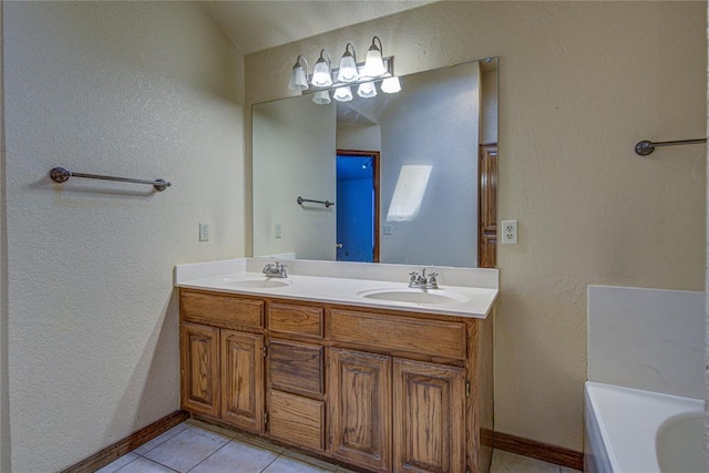 full bath with a textured wall and a sink