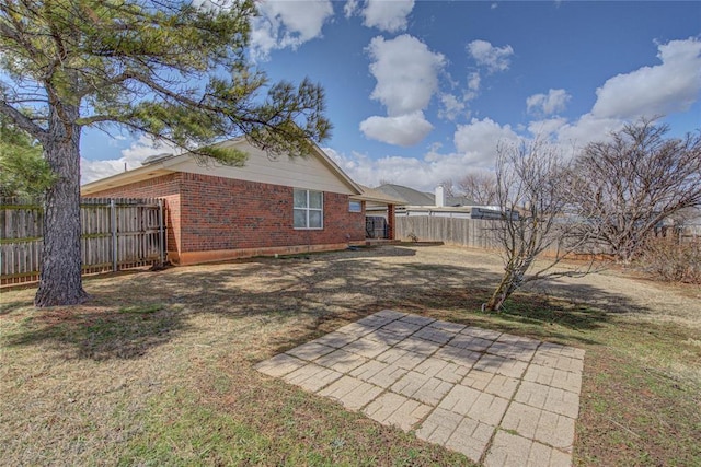 view of yard featuring a patio area and a fenced backyard