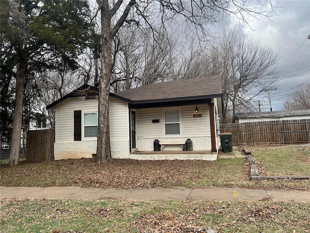 view of front of house with fence