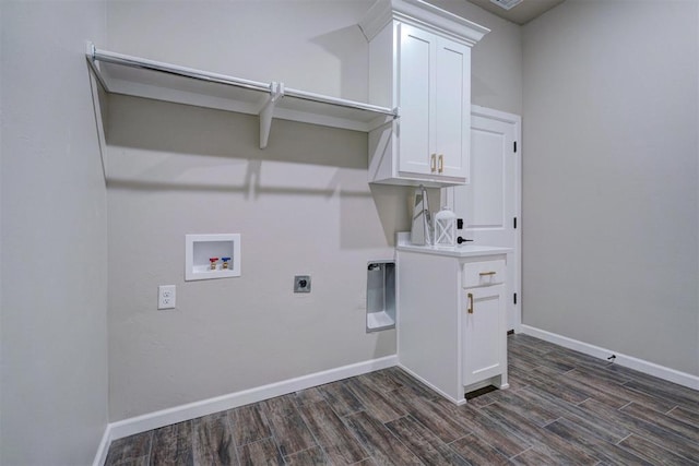 washroom with hookup for a washing machine, dark wood-type flooring, electric dryer hookup, and baseboards