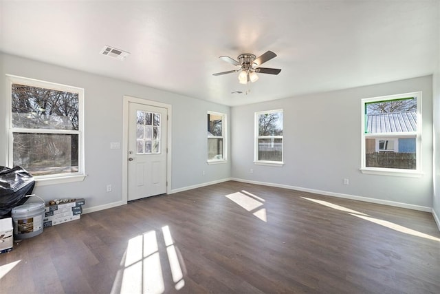 foyer with a ceiling fan, wood finished floors, visible vents, and baseboards