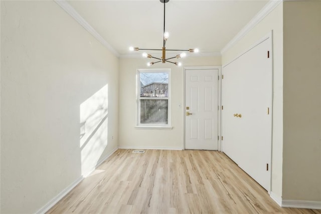 unfurnished dining area featuring visible vents, baseboards, ornamental molding, light wood-style floors, and a notable chandelier