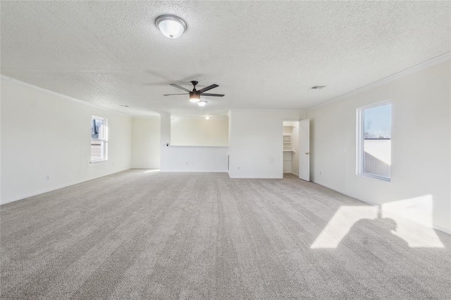 unfurnished living room featuring light carpet and crown molding