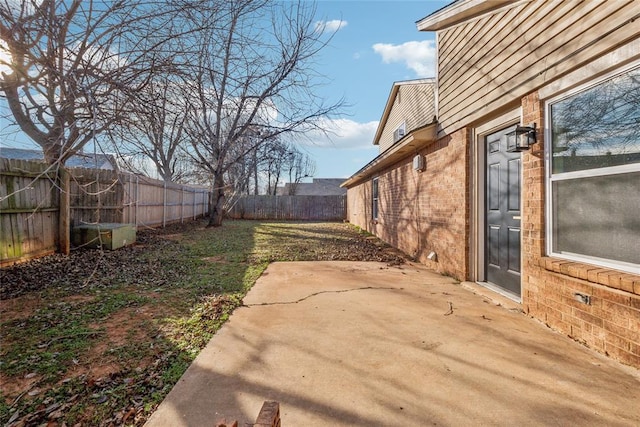 view of yard featuring a patio and a fenced backyard