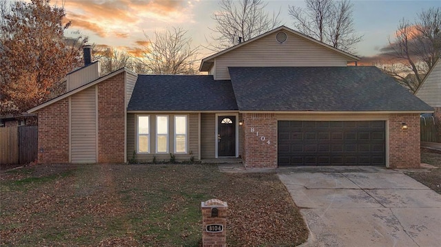 view of front of house featuring fence, driveway, an attached garage, a shingled roof, and brick siding