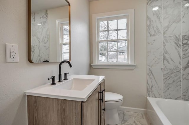 full bath featuring marble finish floor, baseboards, vanity, and toilet