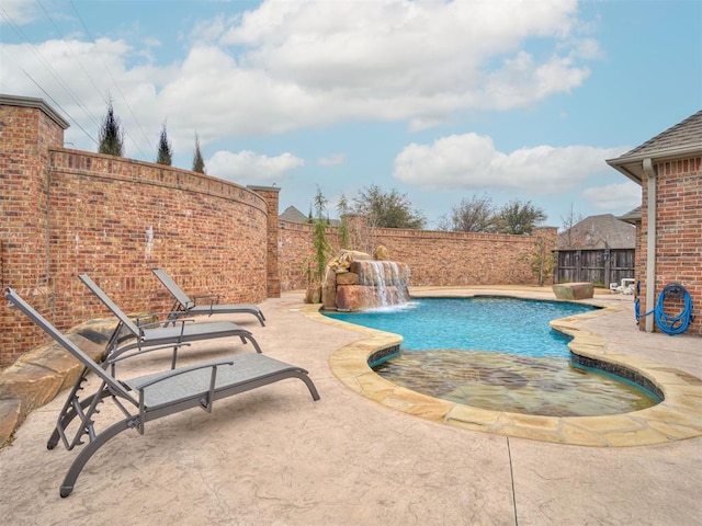 view of swimming pool with a patio, a fenced backyard, and a fenced in pool