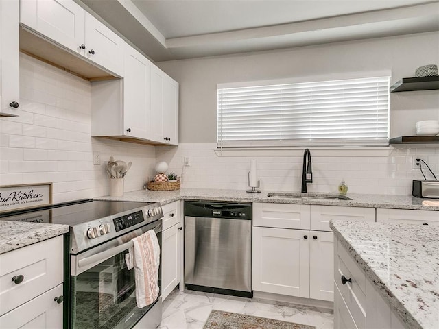 kitchen featuring marble finish floor, open shelves, stainless steel appliances, white cabinetry, and a sink