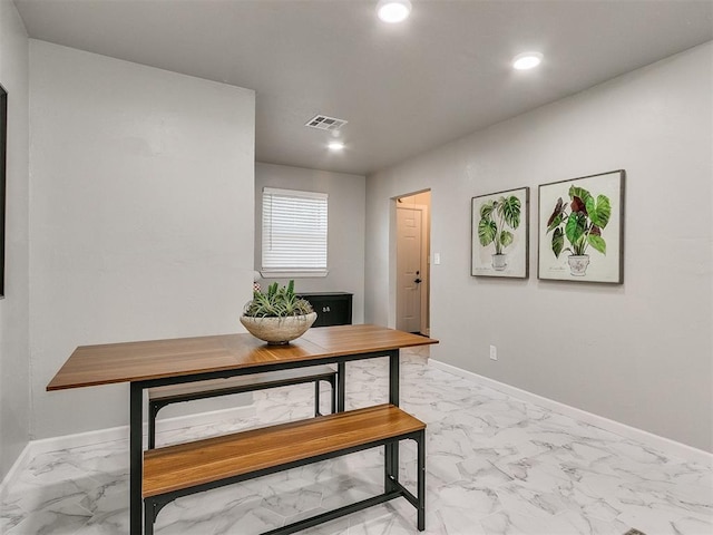 dining space featuring marble finish floor, baseboards, visible vents, and recessed lighting