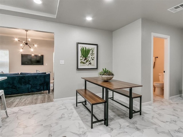 dining room with marble finish floor, visible vents, baseboards, and an inviting chandelier