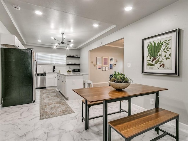 kitchen with marble finish floor, white cabinetry, stainless steel appliances, and light countertops