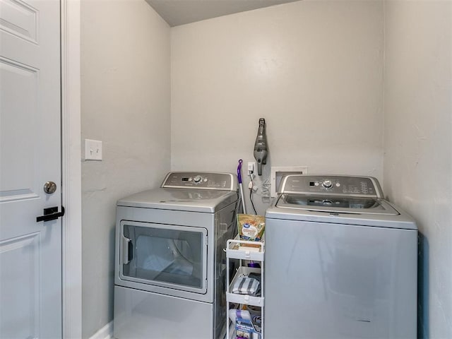 laundry area with laundry area and washer and dryer