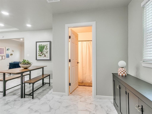 interior space featuring recessed lighting, marble finish floor, visible vents, and baseboards