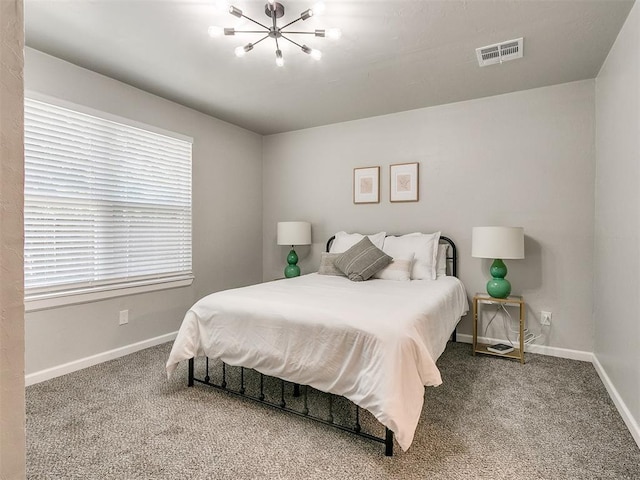 carpeted bedroom with baseboards and visible vents